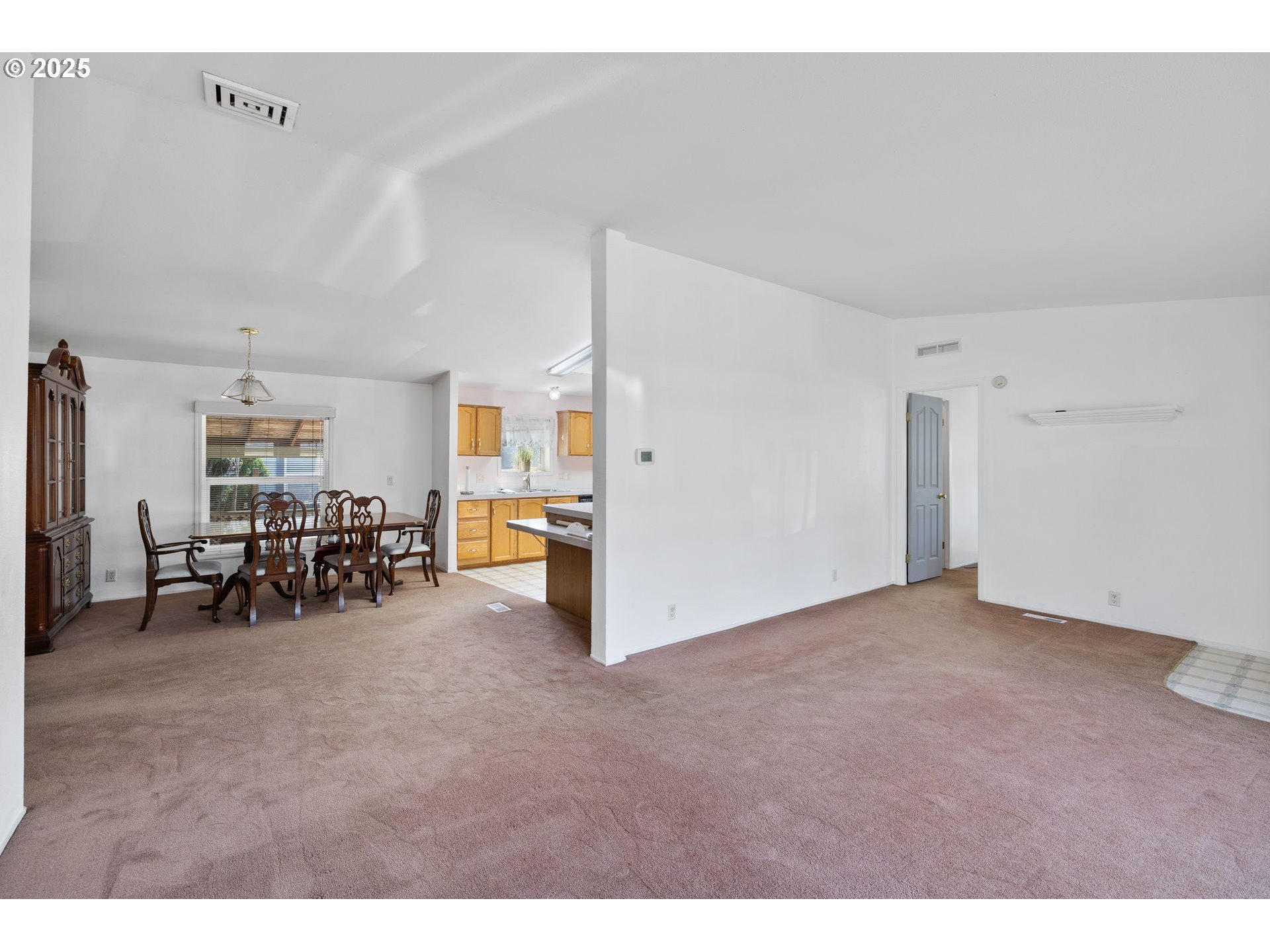 1949 Southeast Palmquist Road, Unit 121 Gresham, OR 97080 - Photo 17 of 37 a view of a livingroom with furniture and white cabinet
