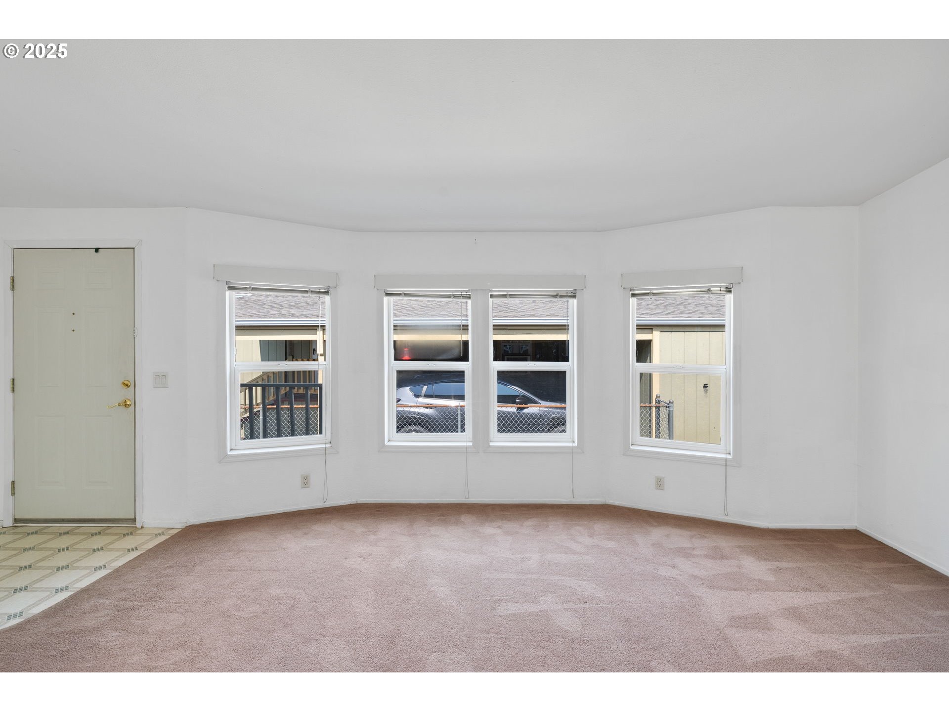 1949 Southeast Palmquist Road, Unit 121 Gresham, OR 97080 - Photo 19 of 37 an empty room with windows