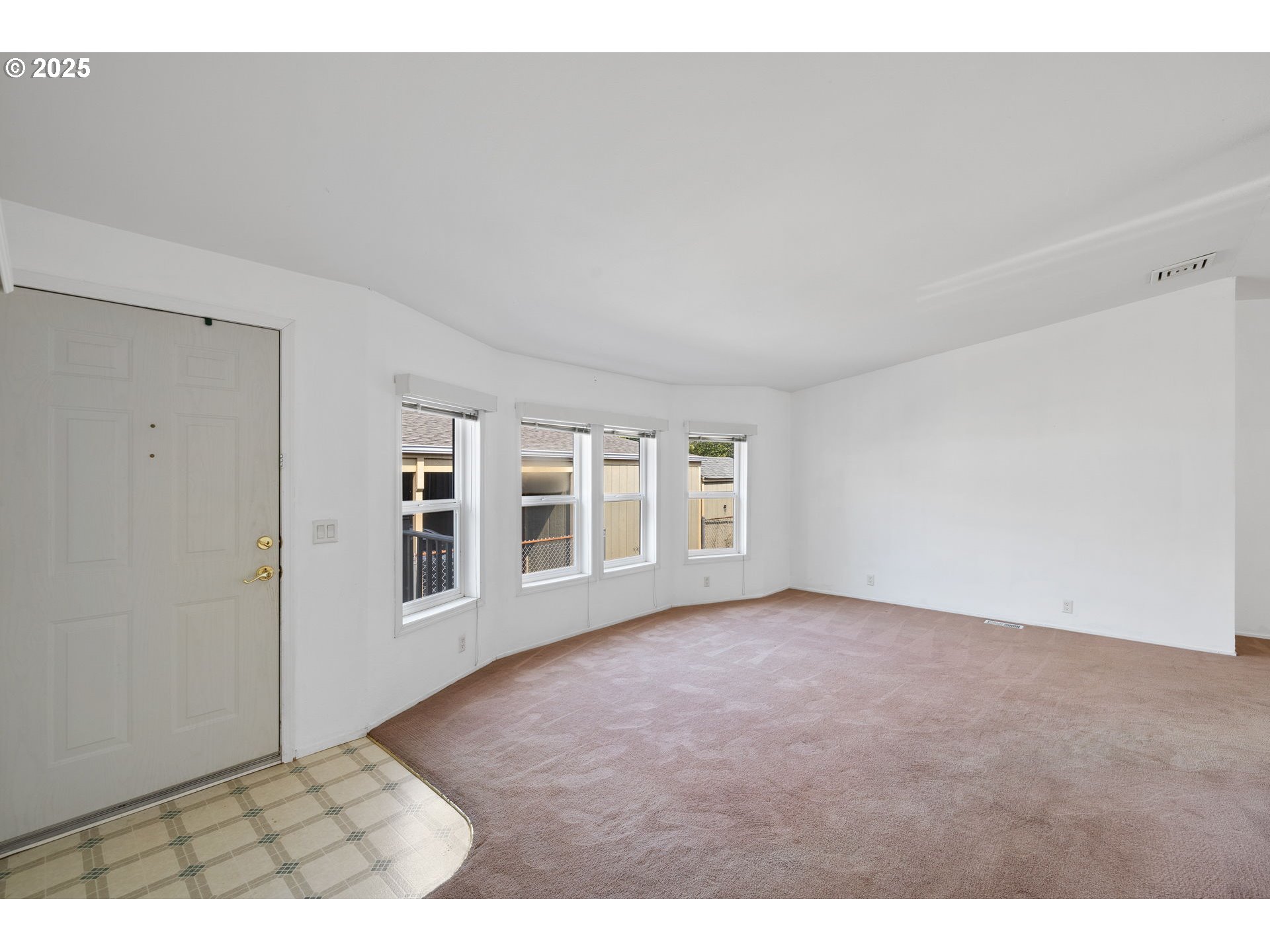 1949 Southeast Palmquist Road, Unit 121 Gresham, OR 97080 - Photo 20 of 37 an empty room with windows