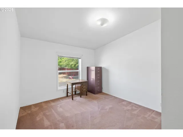 a workspace with furniture and a window