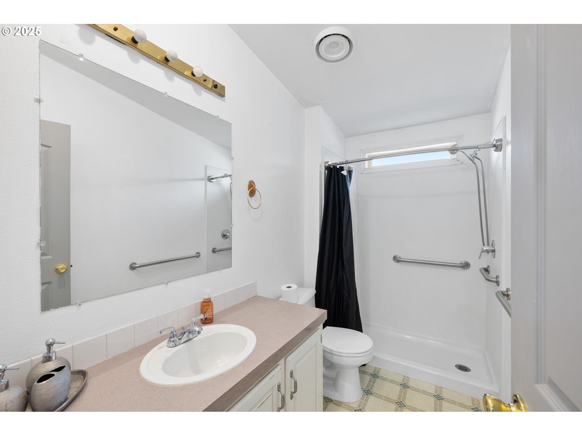 1949 Southeast Palmquist Road, Unit 121 Gresham, OR 97080 - Photo 24 of 37 a bathroom with a sink toilet and shower