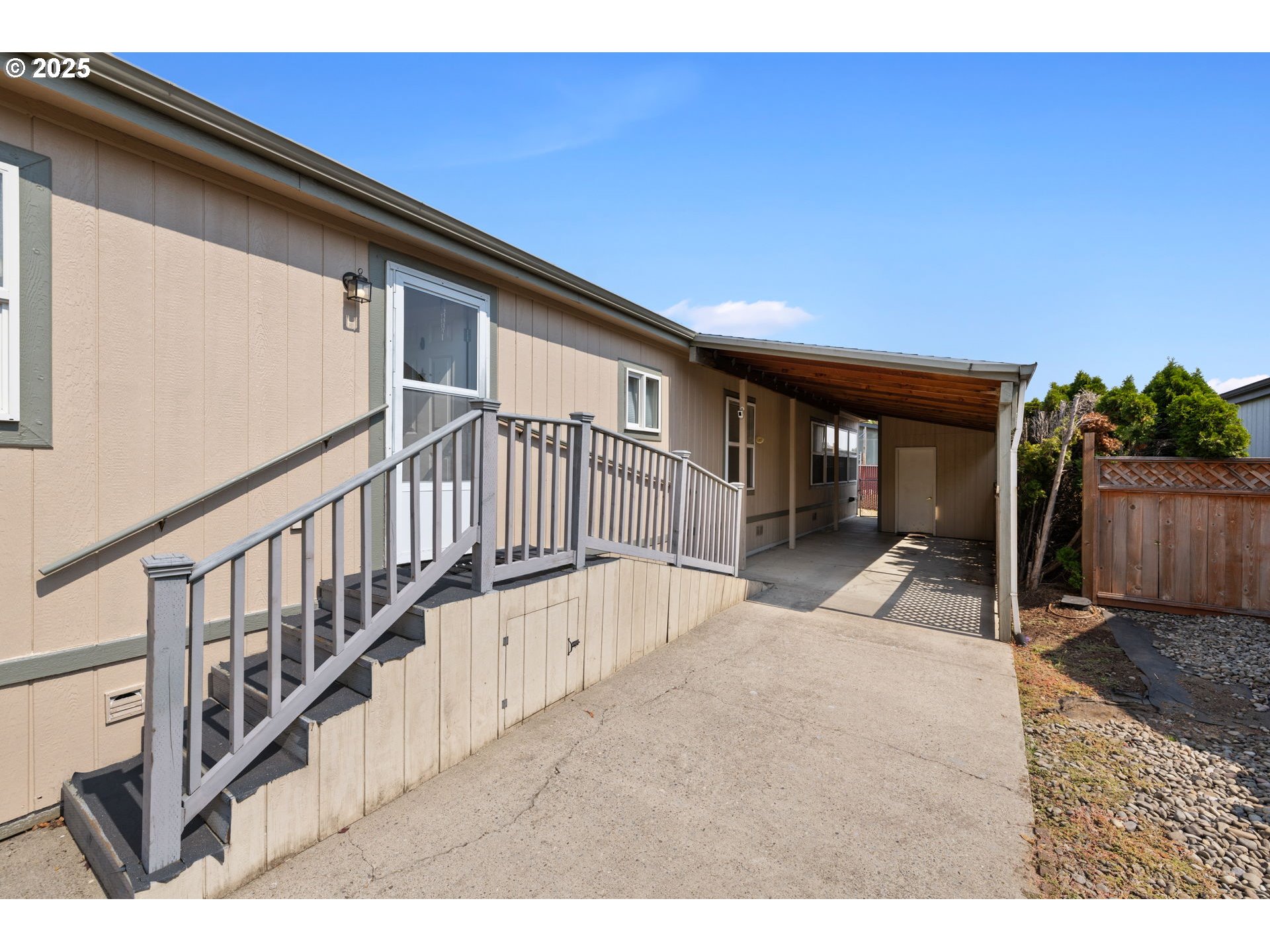 1949 Southeast Palmquist Road, Unit 121 Gresham, OR 97080 - Photo 3 of 37 a view of a house with wooden floor and a small yard