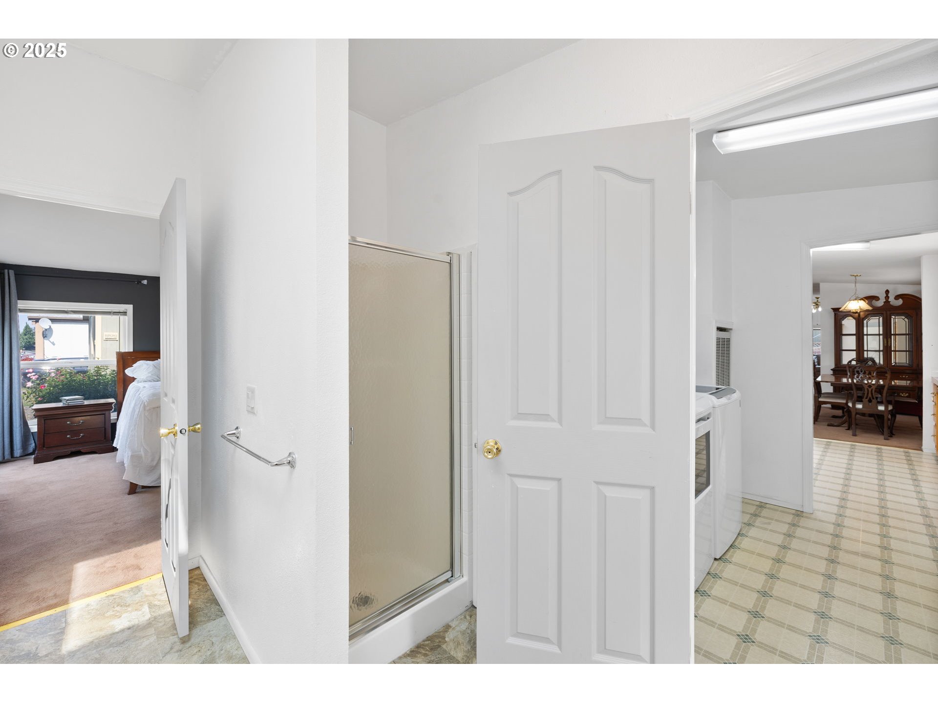 1949 Southeast Palmquist Road, Unit 121 Gresham, OR 97080 - Photo 34 of 37 a view of a hallway with wooden floor and furniture