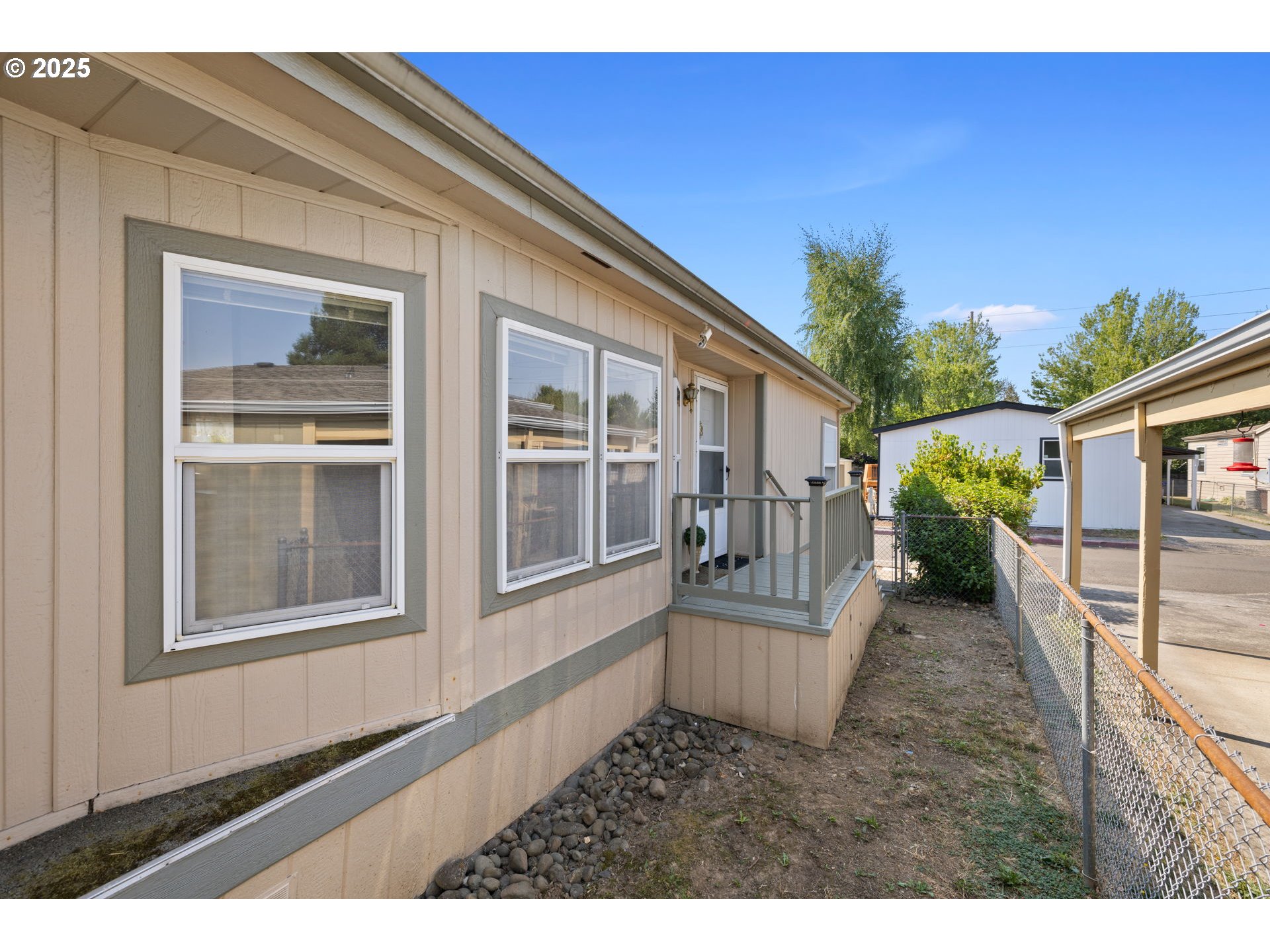 1949 Southeast Palmquist Road, Unit 121 Gresham, OR 97080 - Photo 5 of 37 a view of a house with backyard and porch