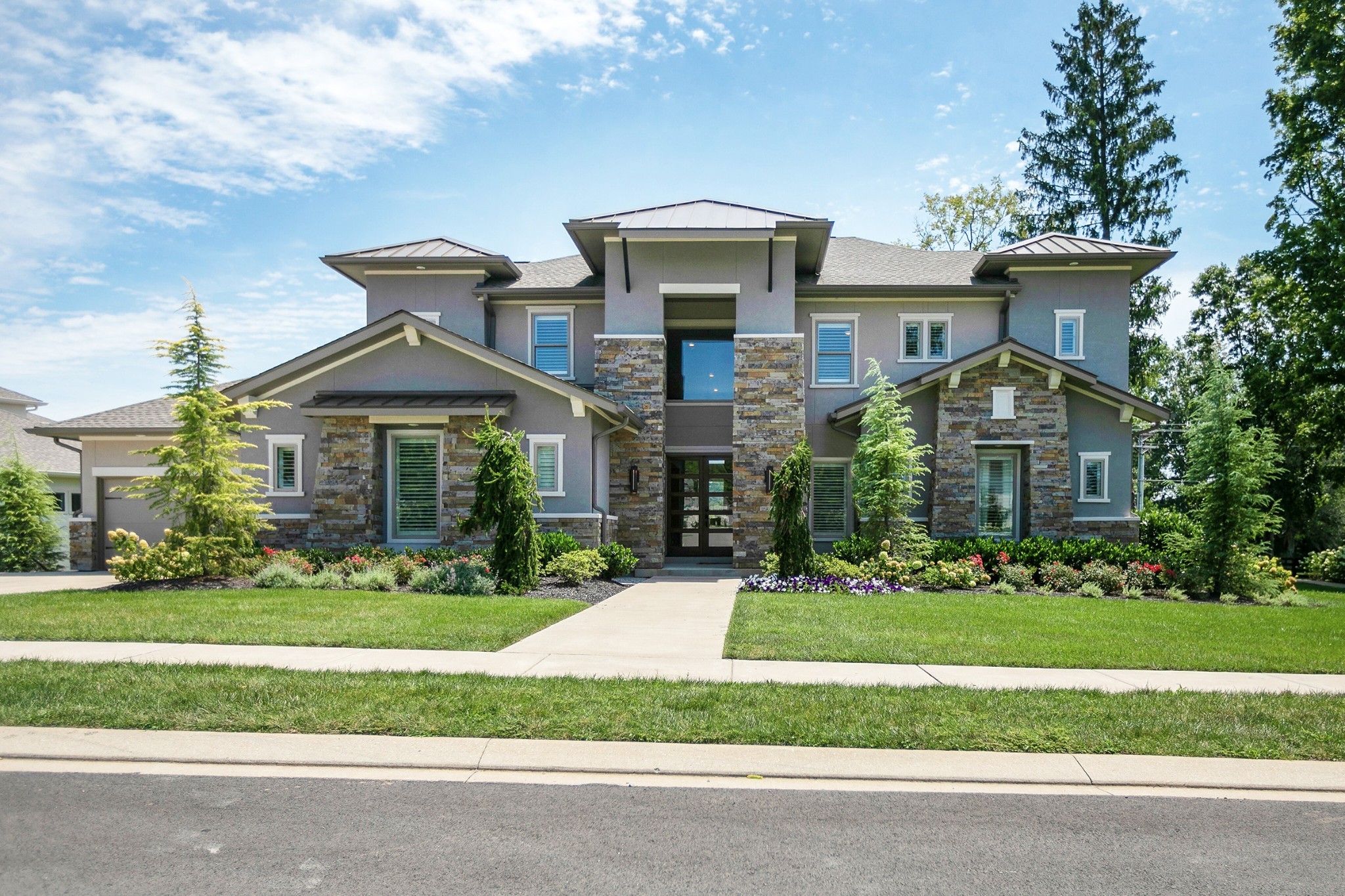a front view of a house with a yard