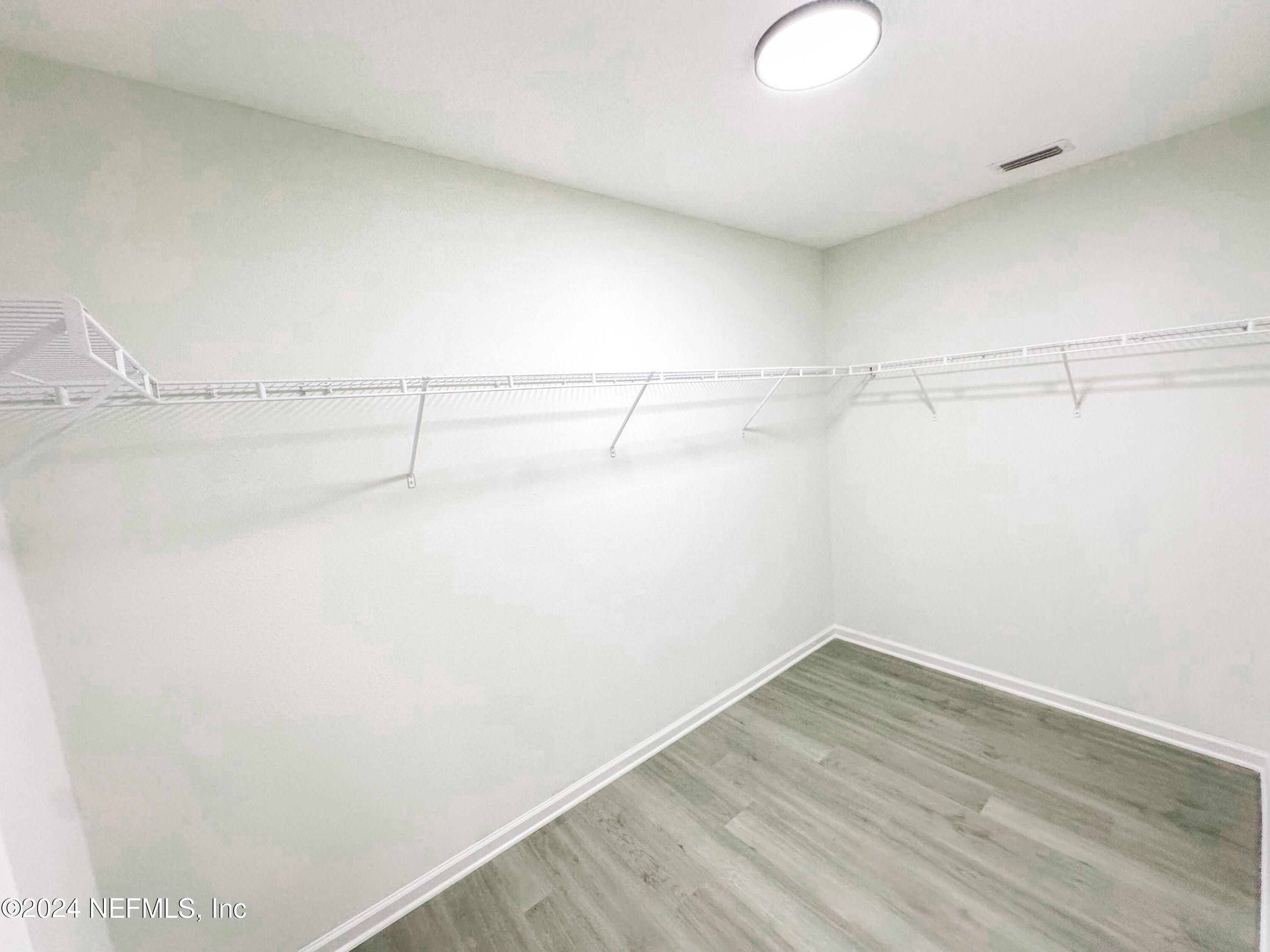 1047 Fleming Street Fleming Island, FL 32003 - Photo 12 of 15 a view of a room with racks on the wall