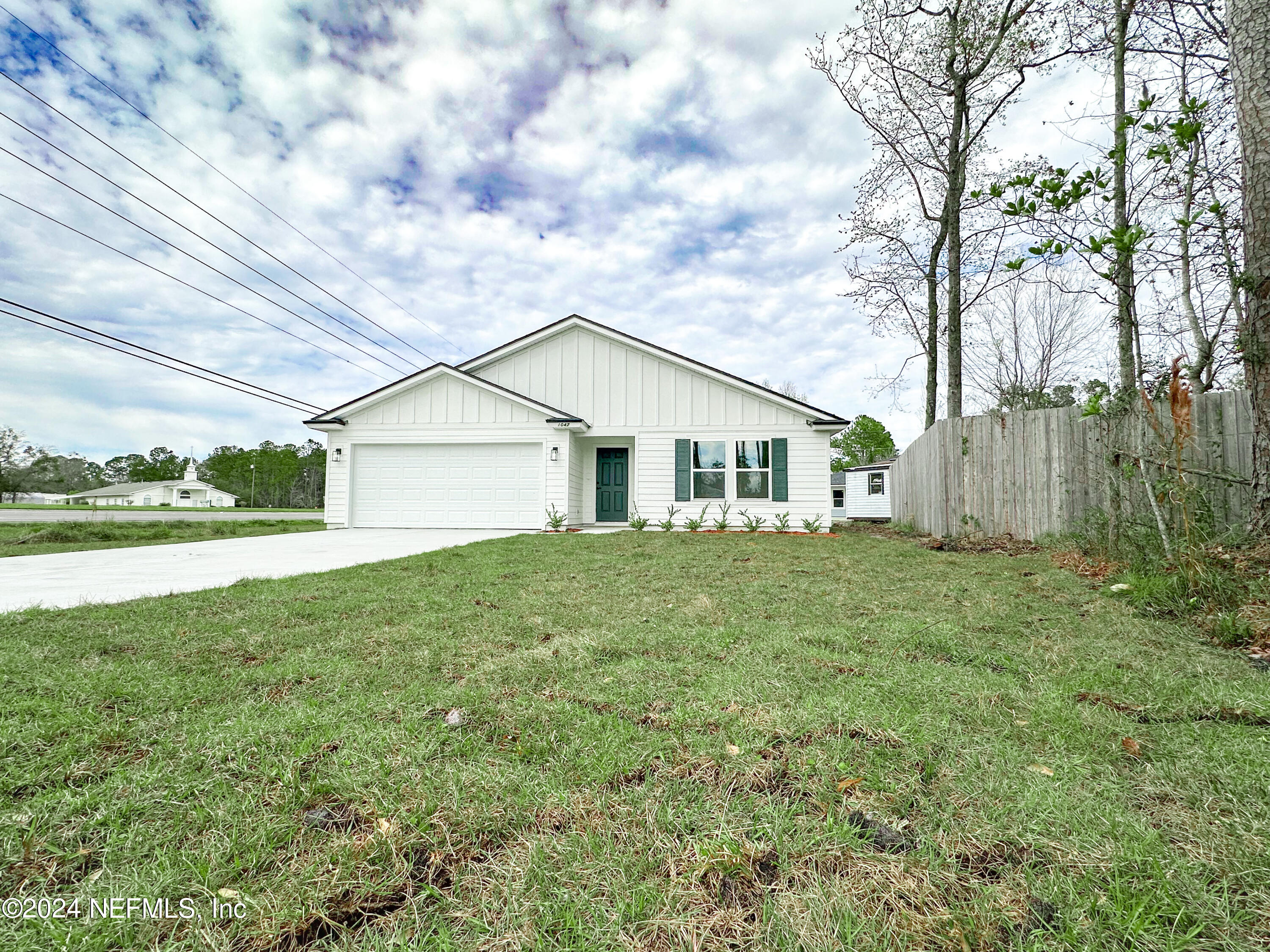 1047 Fleming Street Fleming Island, FL 32003 - Photo 4 of 15 a view of a house with backyard and garden