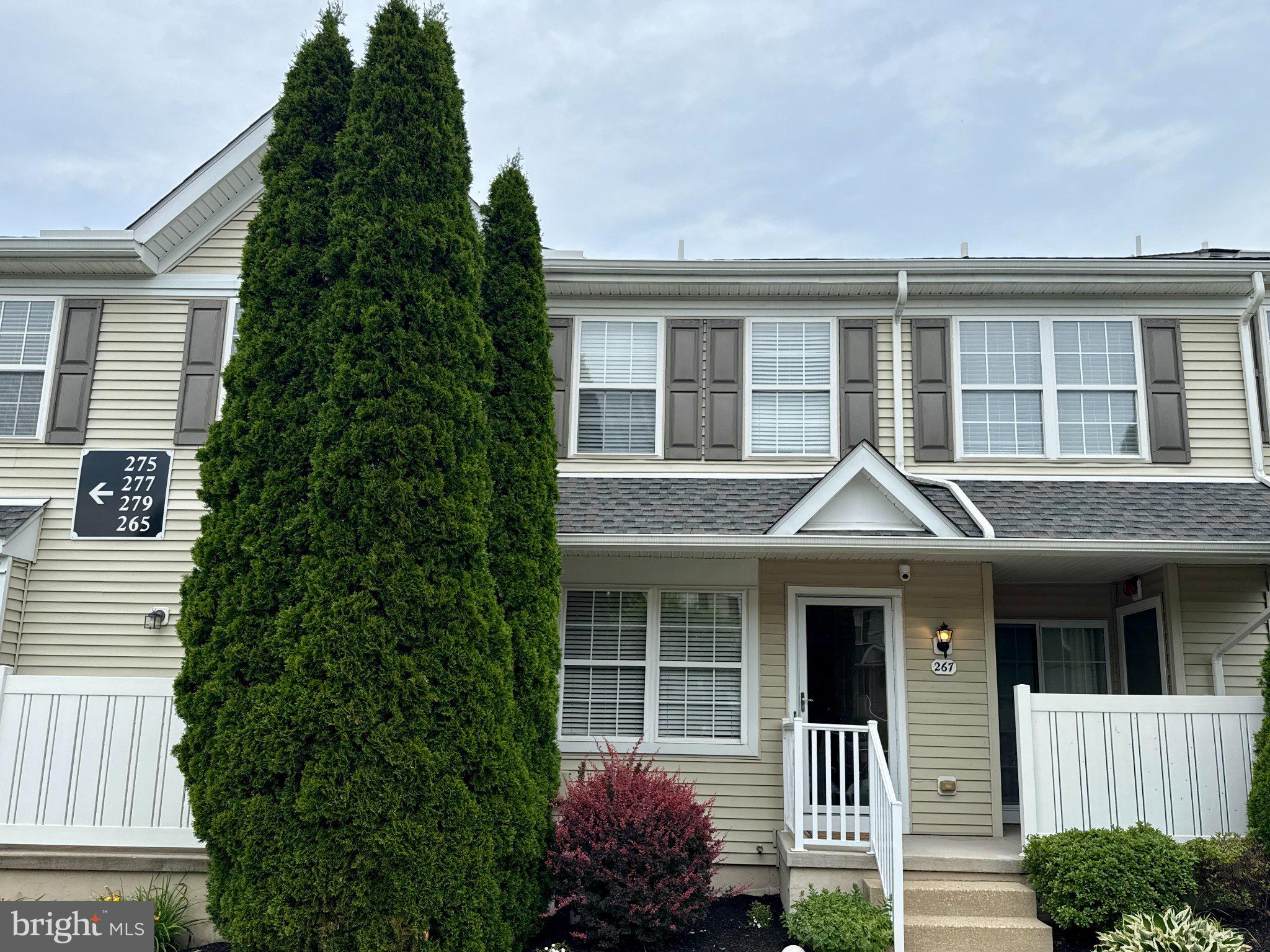 267 Flagstone Road, Unit 6 Chester Springs, PA 19425 - Photo 2 of 27 Charming townhouse with lush greenery.