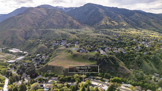 1365 Sumac Drive Logan, UT 84321 - Photo 9 of 66 Aerial perspective showcasing a residential neighborhood nestled within a mountainous landscape