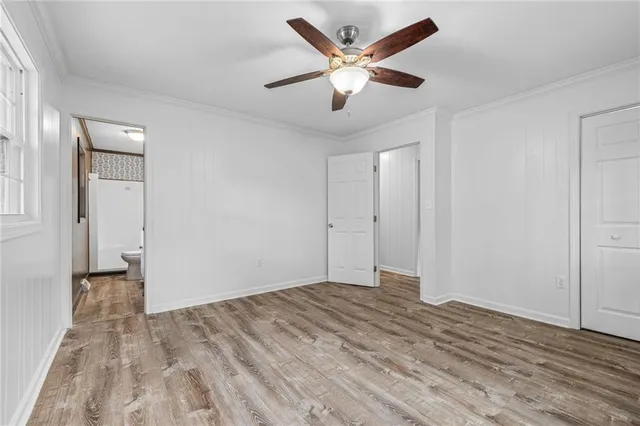 a bathroom with a sink toilet and a mirror