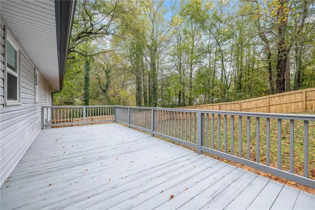 a aerial view of a house with a yard and lake view