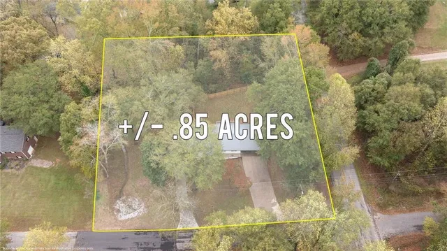 a view of a swimming pool with a yard