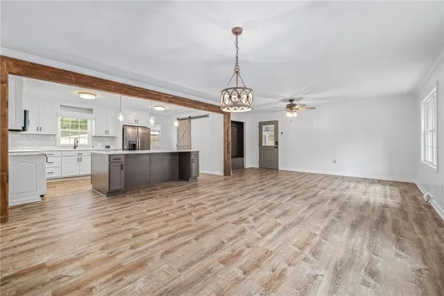 a bedroom with a large bed and a large window