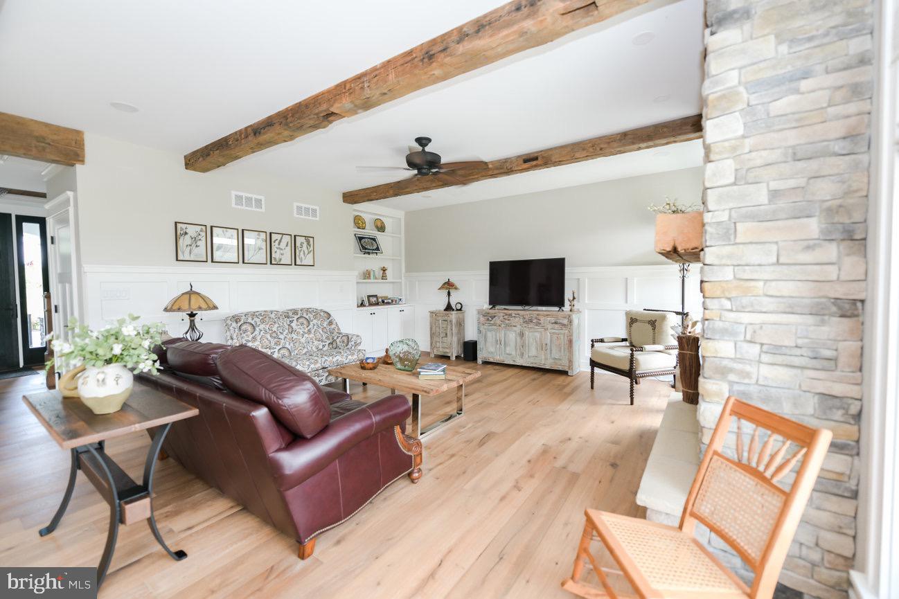 7091 Schoolhouse Road Hershey, PA 17033 - Photo 11 of 37 a living room with furniture and a flat screen tv