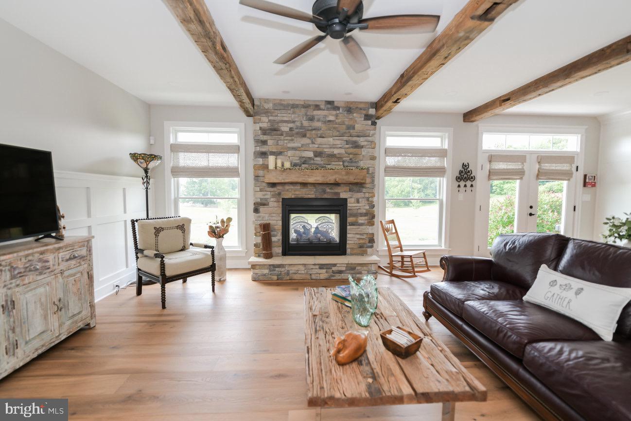 7091 Schoolhouse Road Hershey, PA 17033 - Photo 12 of 37 a living room with furniture and a fireplace