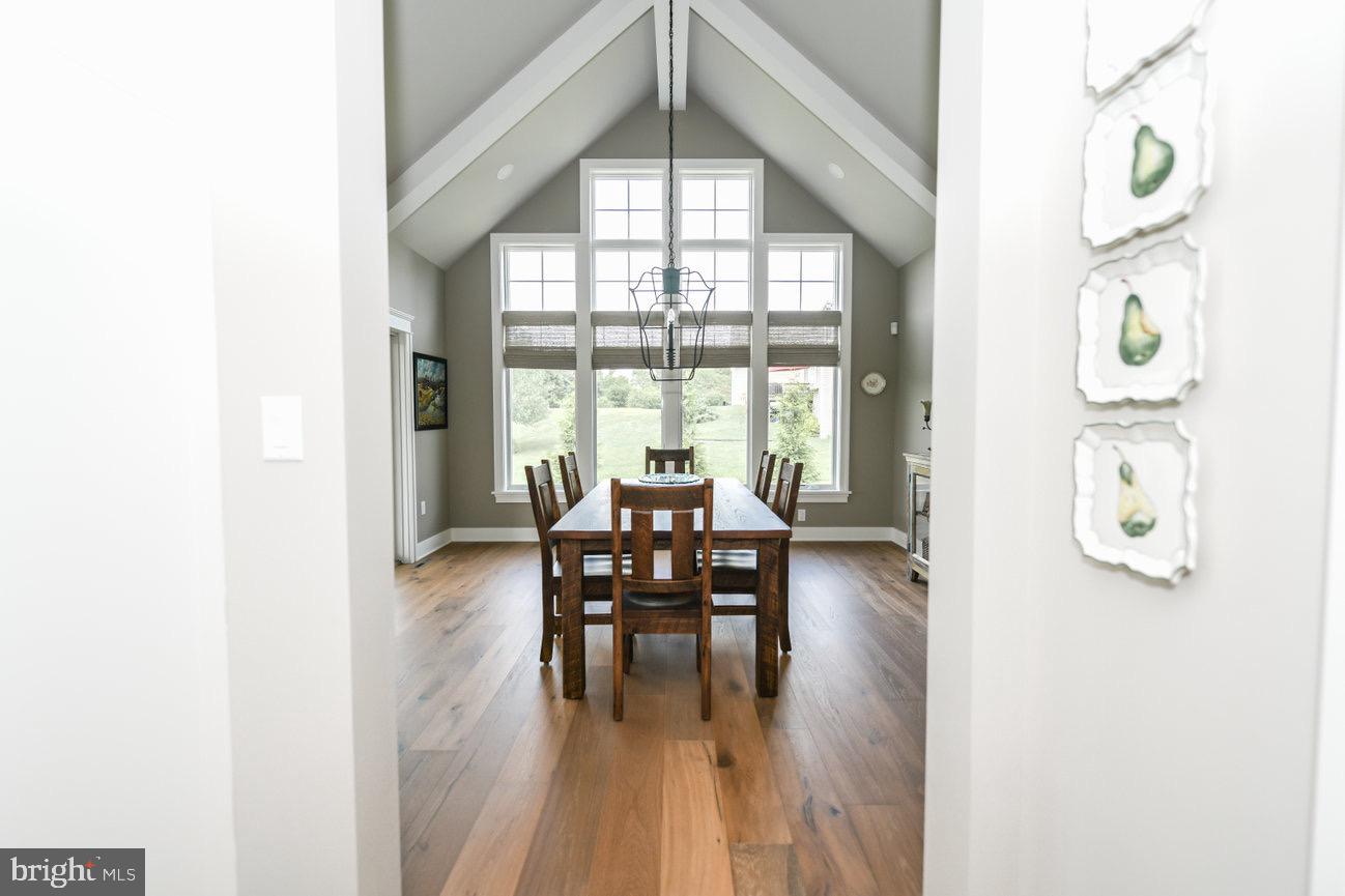 7091 Schoolhouse Road Hershey, PA 17033 - Photo 13 of 37 a dining room with furniture and wooden floor