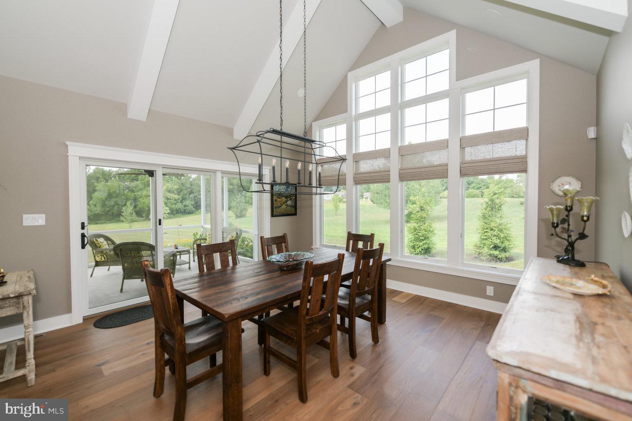 7091 Schoolhouse Road Hershey, PA 17033 - Photo 14 of 37 a view of a dining room with furniture window and wooden floor