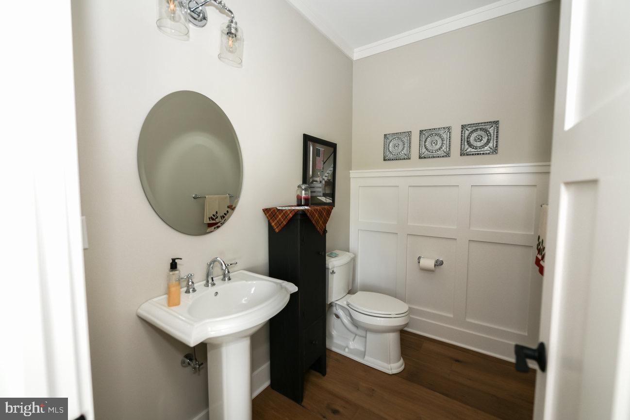 7091 Schoolhouse Road Hershey, PA 17033 - Photo 19 of 37 a bathroom with a sink toilet and a mirror