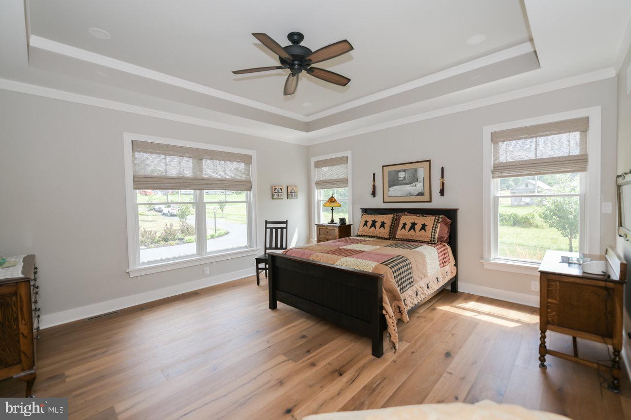 7091 Schoolhouse Road Hershey, PA 17033 - Photo 21 of 37 a bed sitting in a spacious bedroom next to a window