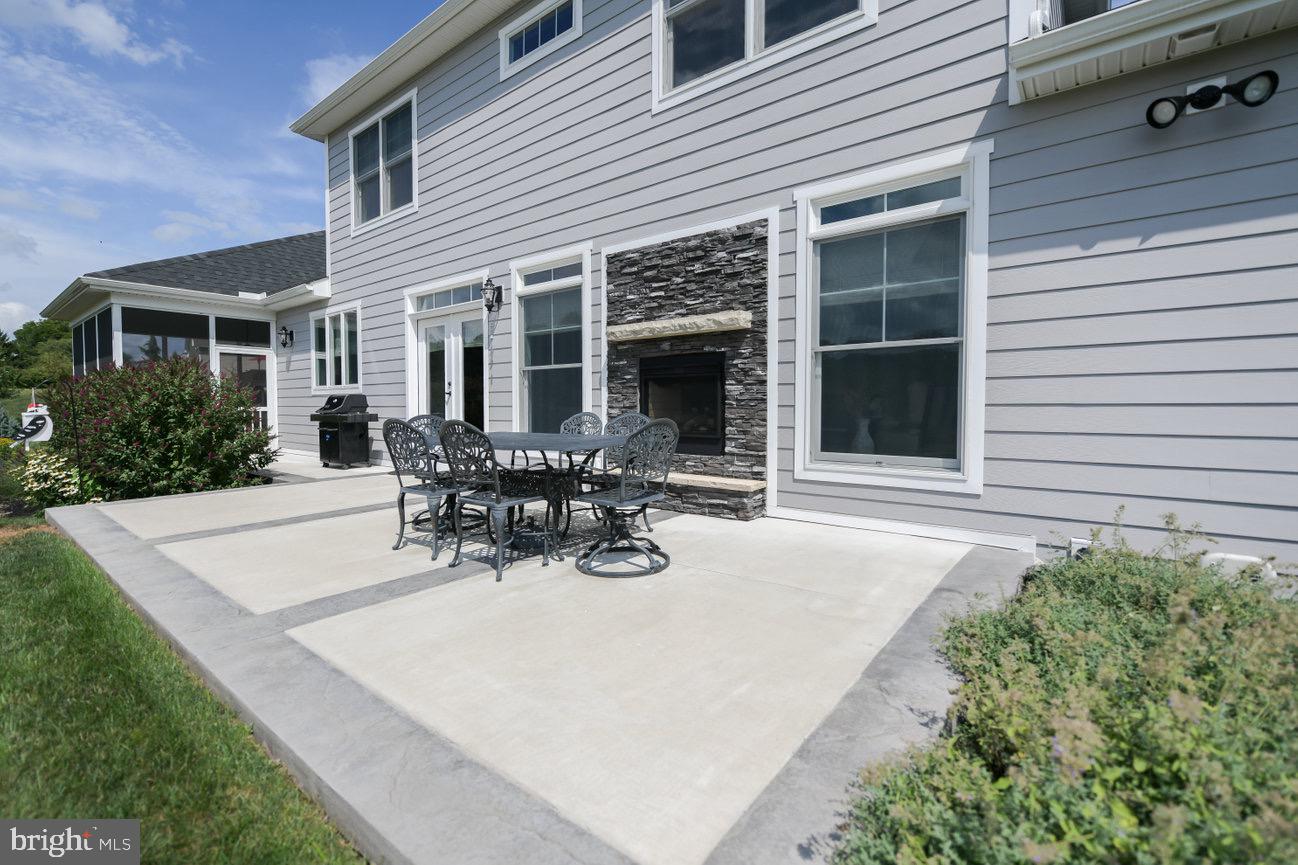 7091 Schoolhouse Road Hershey, PA 17033 - Photo 33 of 37 a view of a house with dining area and garden