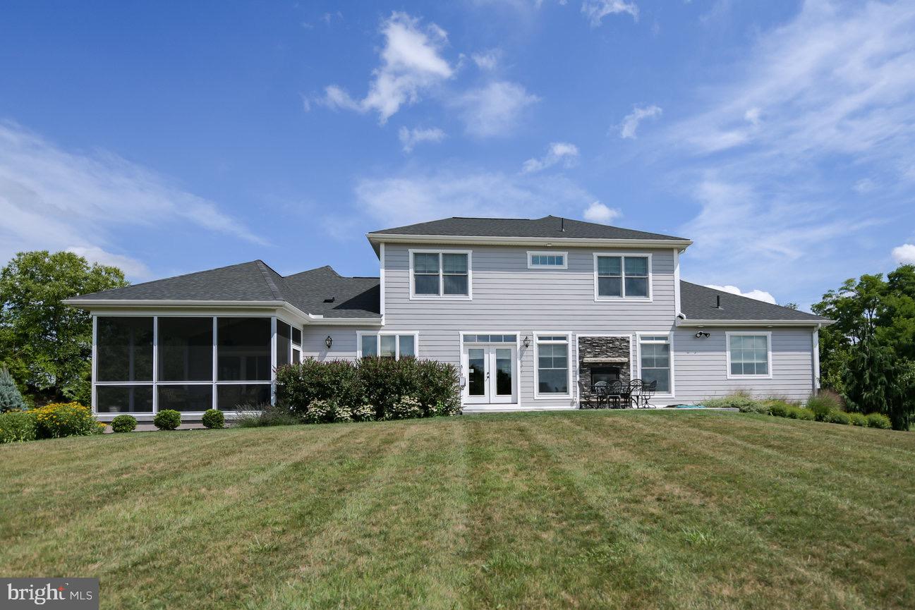 7091 Schoolhouse Road Hershey, PA 17033 - Photo 35 of 37 a front view of a house with garden