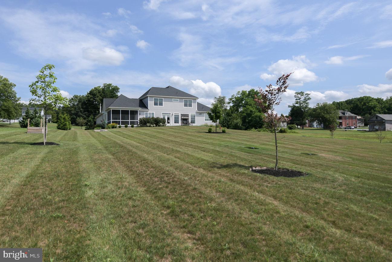 7091 Schoolhouse Road Hershey, PA 17033 - Photo 36 of 37 a front view of a house with a yard and trees