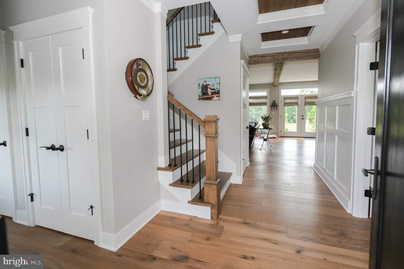 7091 Schoolhouse Road Hershey, PA 17033 - Photo 4 of 37 a view of a hallway with wooden floor