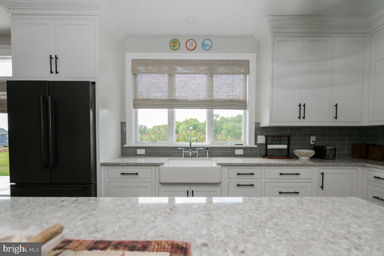 7091 Schoolhouse Road Hershey, PA 17033 - Photo 8 of 37 a kitchen with stainless steel appliances a stove a sink and a refrigerator