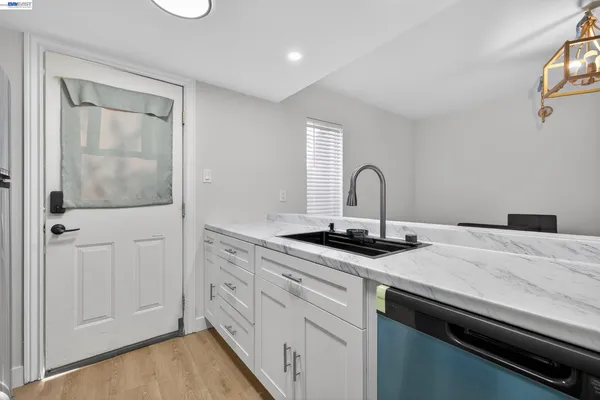 a kitchen with a sink and cabinets