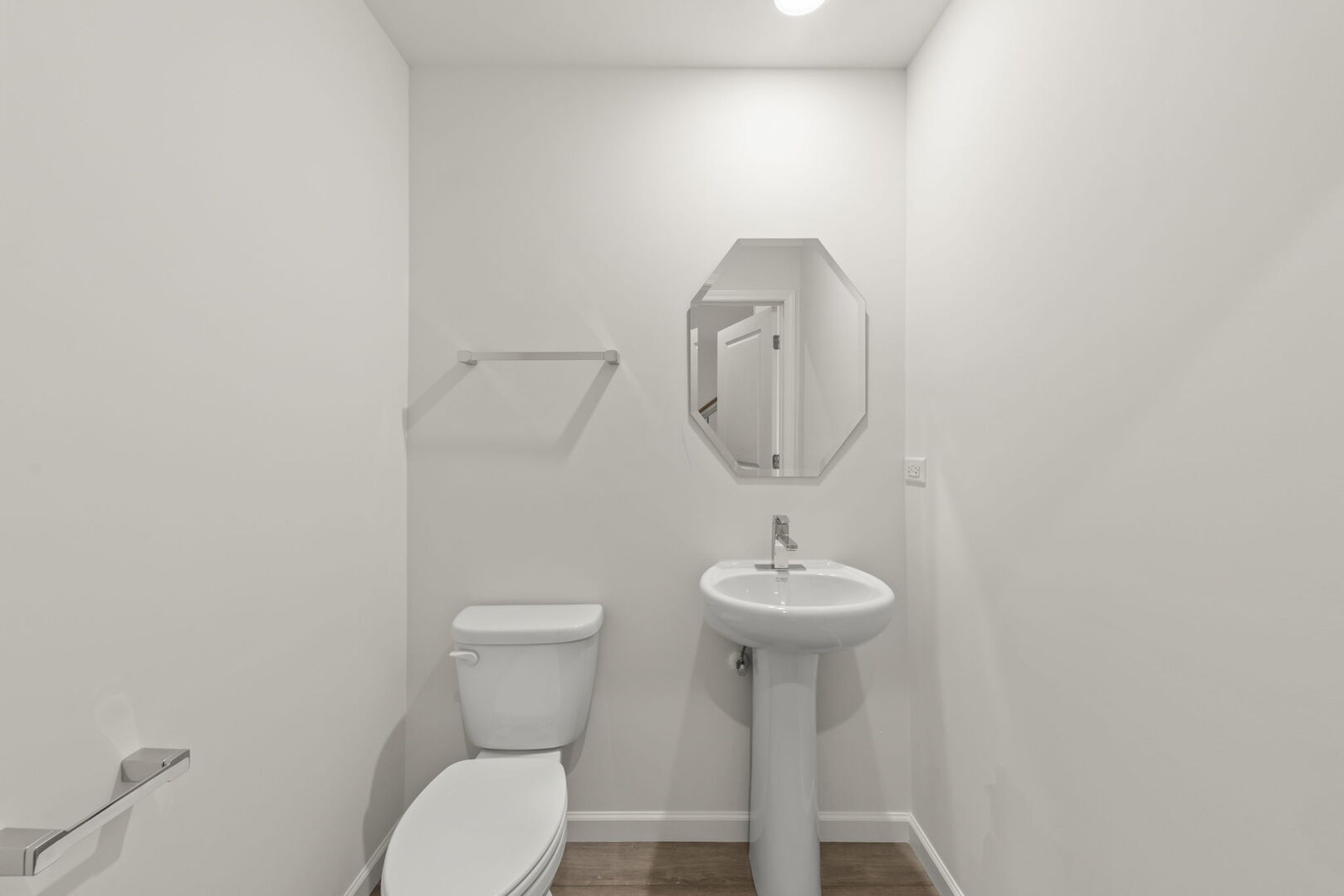 664 Switchgrass Way Bolingbrook, IL 60490 - Photo 13 of 35 a bathroom with a toilet sink and mirror