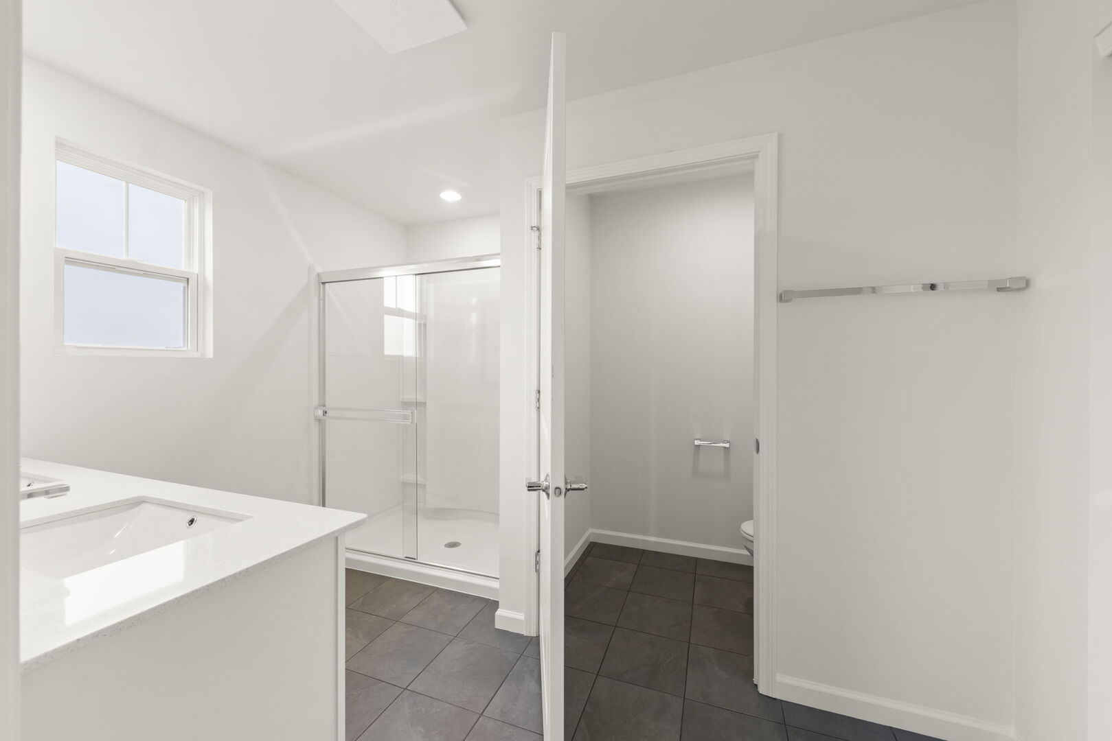 664 Switchgrass Way Bolingbrook, IL 60490 - Photo 16 of 35 a bathroom with a tub shower and sink