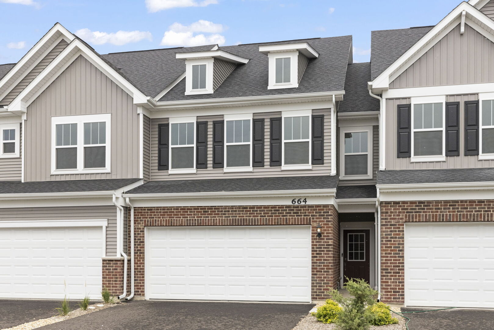 664 Switchgrass Way Bolingbrook, IL 60490 - Photo 2 of 35 a view of a white house with large windows