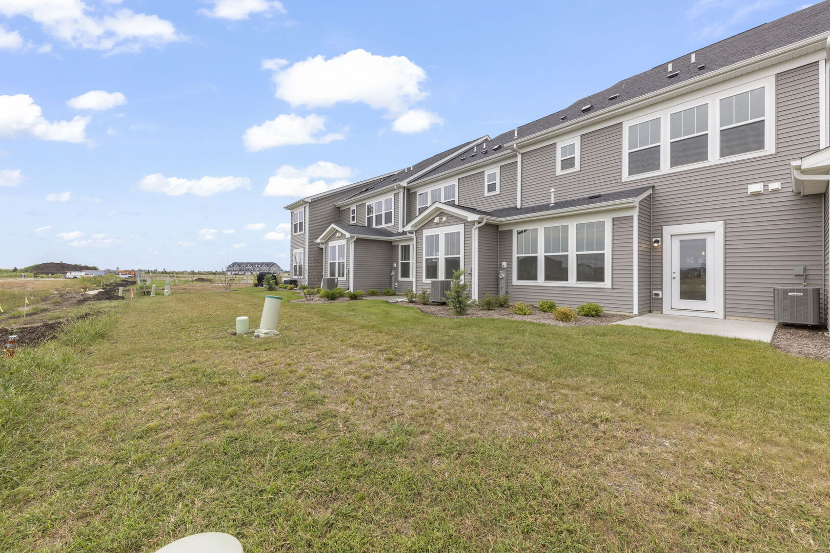 664 Switchgrass Way Bolingbrook, IL 60490 - Photo 27 of 35 a view of a house with a yard and sitting area