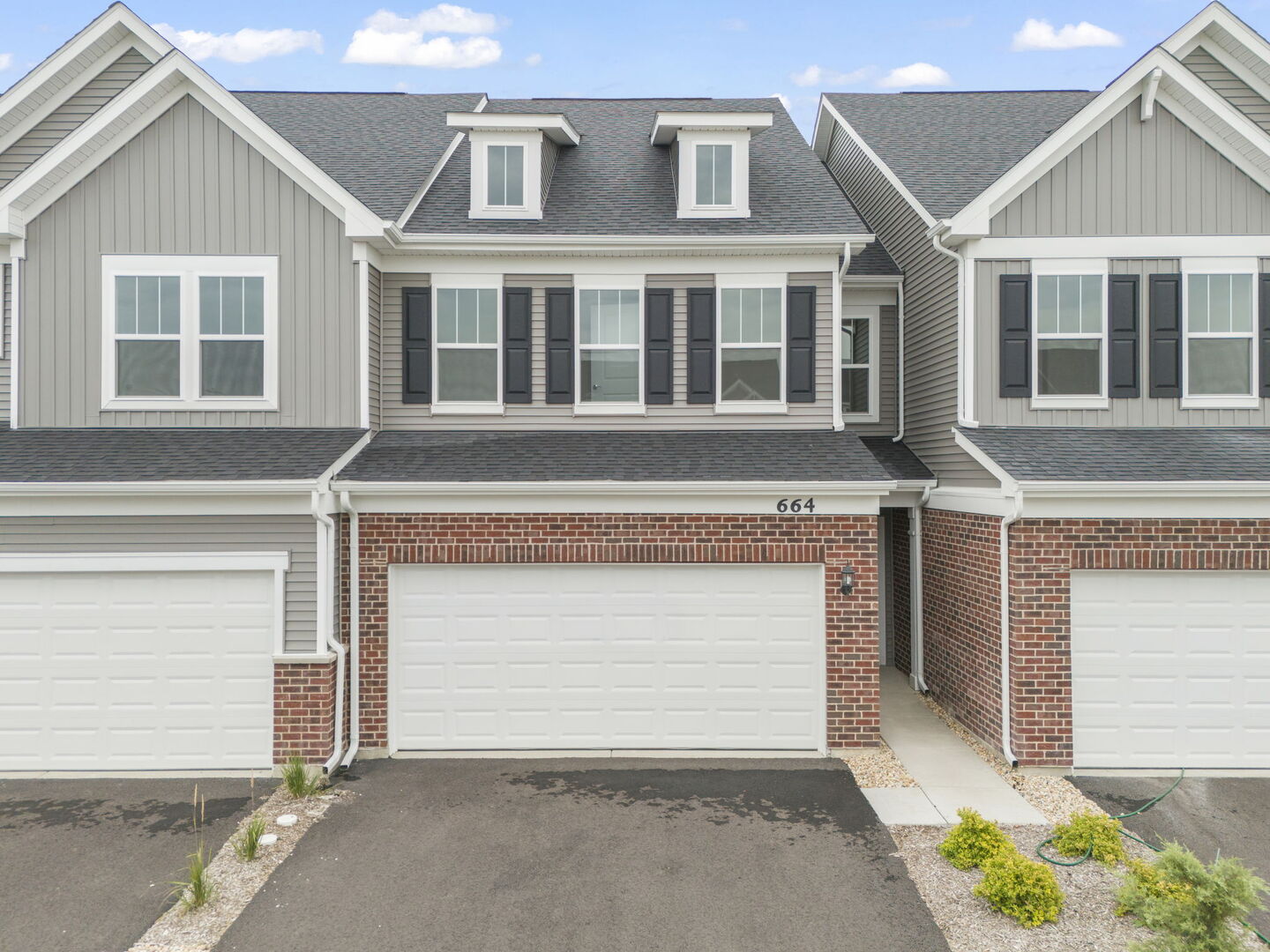664 Switchgrass Way Bolingbrook, IL 60490 - Photo 34 of 35 a front view of a house with a garage