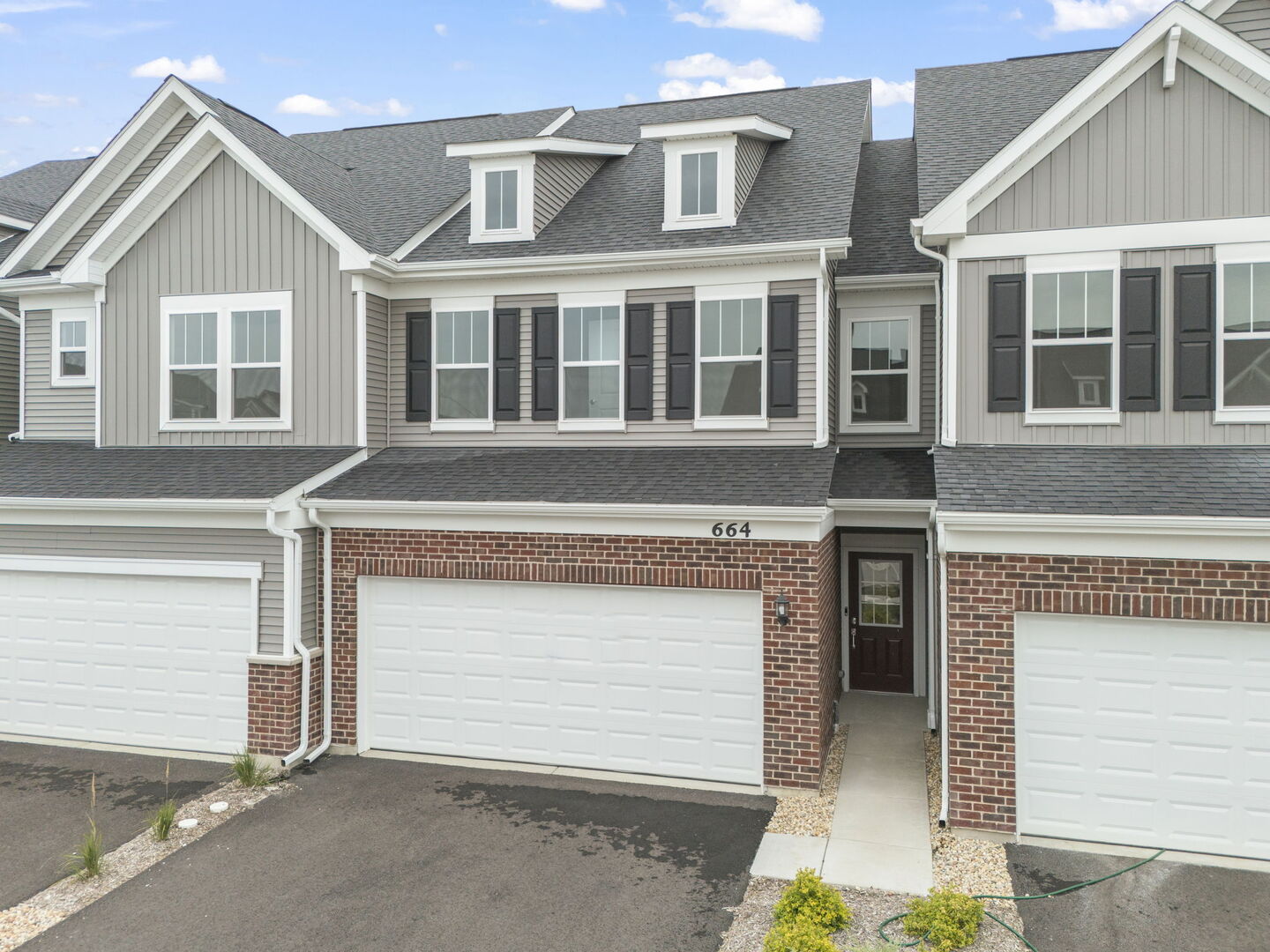 664 Switchgrass Way Bolingbrook, IL 60490 - Photo 35 of 35 a front view of a house with a garage and balcony
