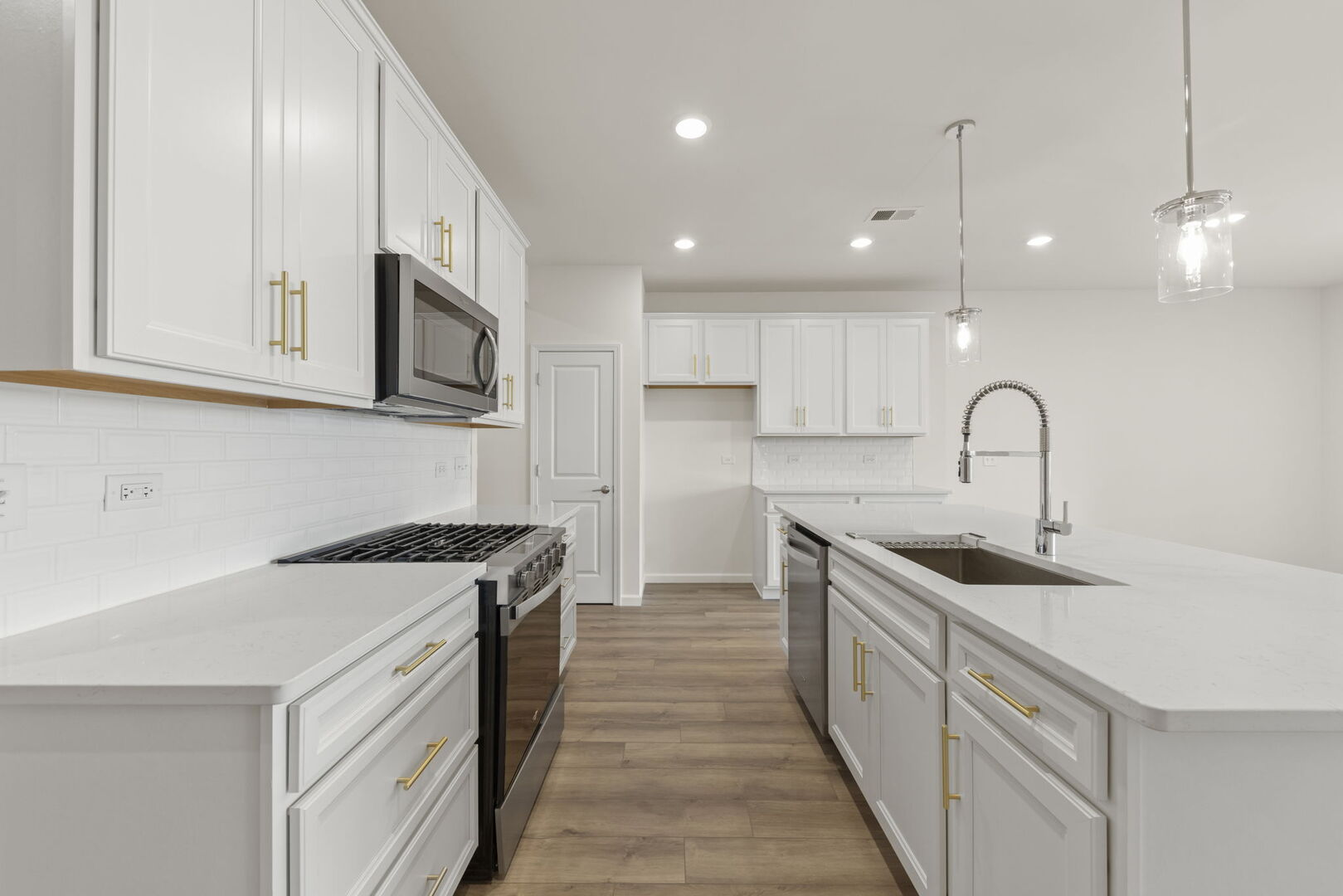 664 Switchgrass Way Bolingbrook, IL 60490 - Photo 5 of 35 a kitchen with a sink stove and cabinets