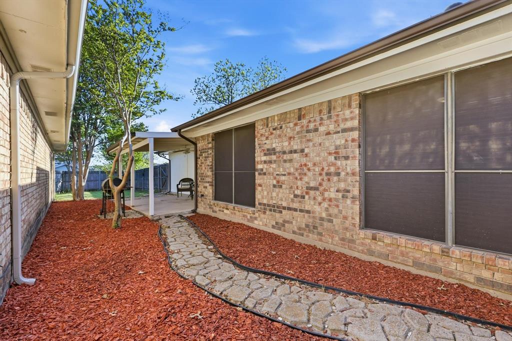 1312 Hackamore Street Mesquite, TX 75149 - Photo 19 of 23 Fenced backyard with a patio area