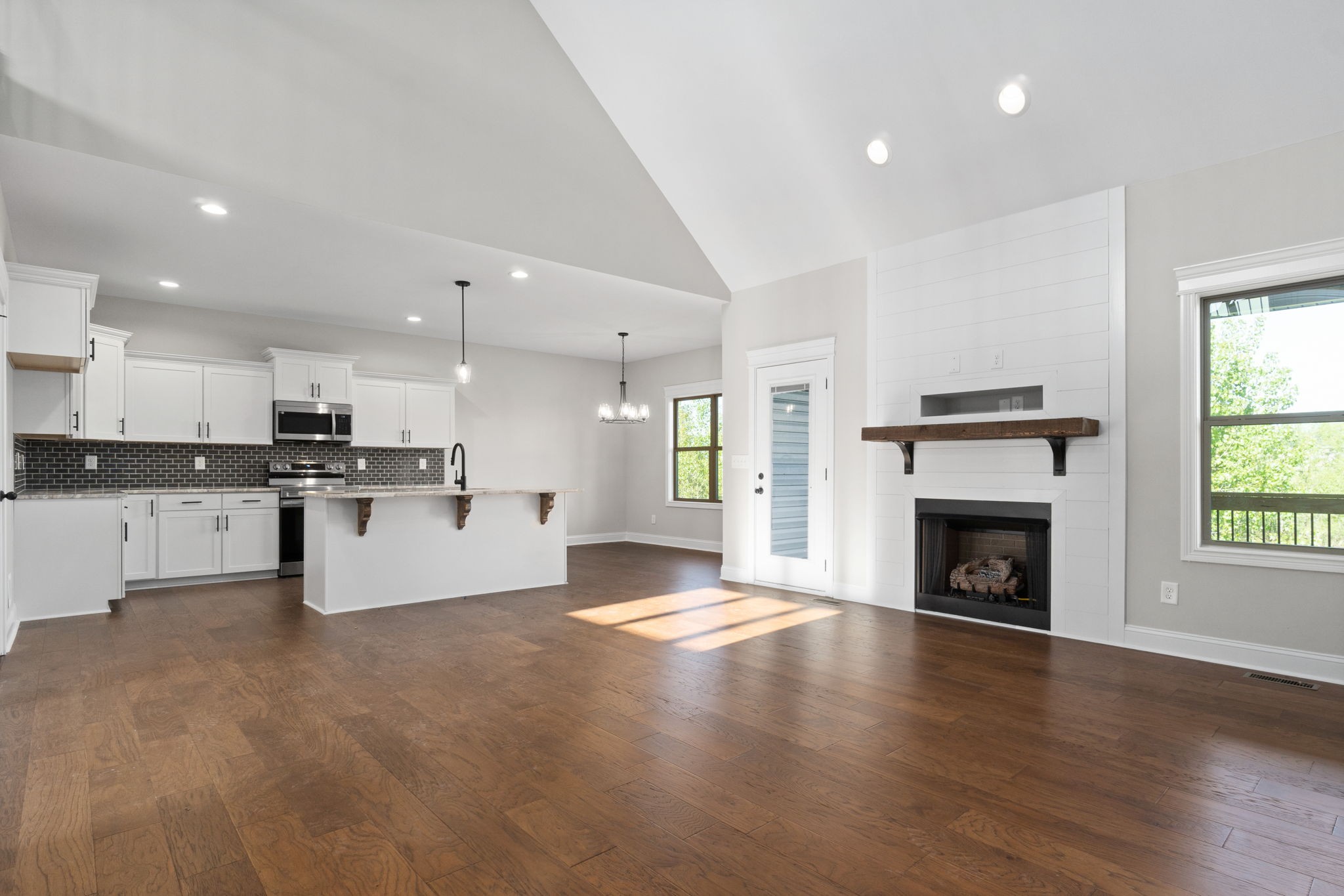 2964 Kirkwood Road Clarksville, TN 37043 - Photo 7 of 35 a view of kitchen with fireplace and wooden floor