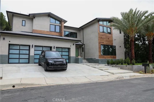 a car parked in front of a white building