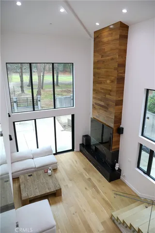 a living room with furniture and next to a window