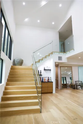 a living room with furniture and a floor to ceiling window