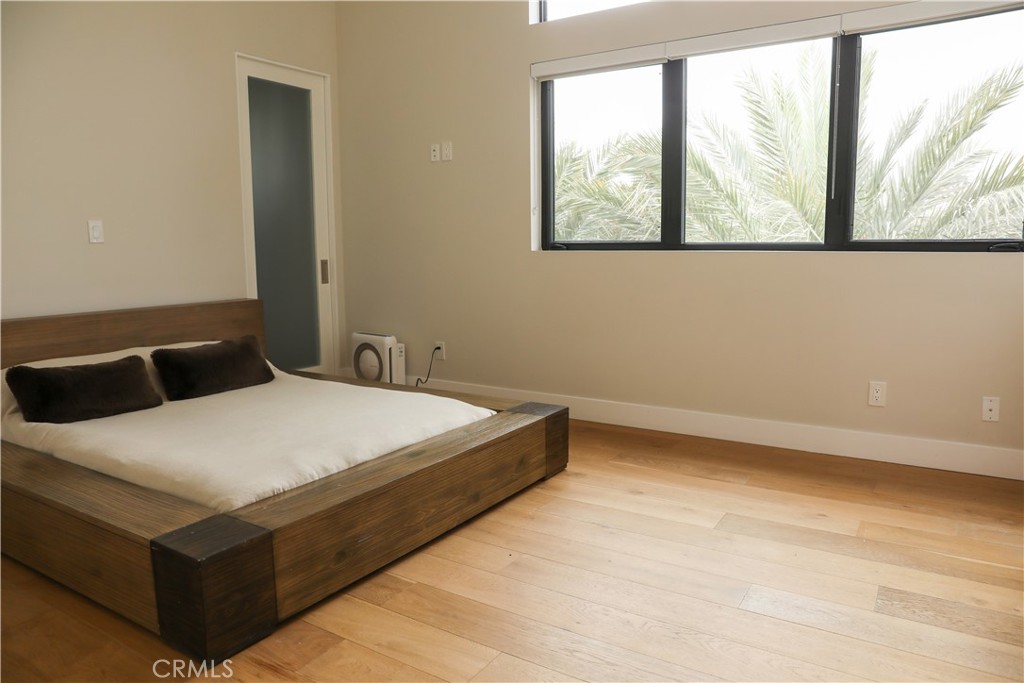 12664 McLennan Avenue Granada Hills, CA 91344 - Photo 23 of 61 a large bed sitting in a bedroom next to a window