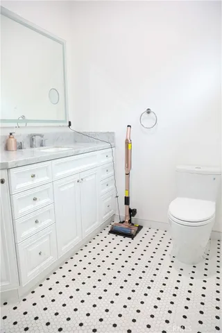 a living room with furniture a flat screen tv and a large window
