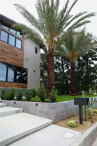a bedroom with a large bed and a large window