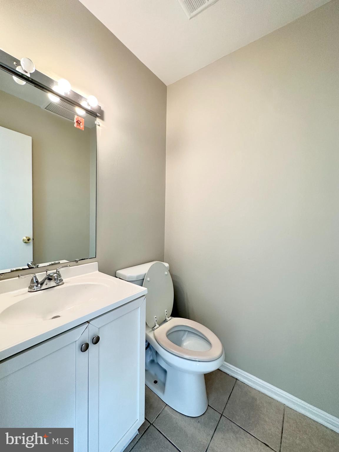 402 Carousel Court Gaithersburg, MD 20877 - Photo 15 of 29 a white toilet sitting next to a bathroom sink
