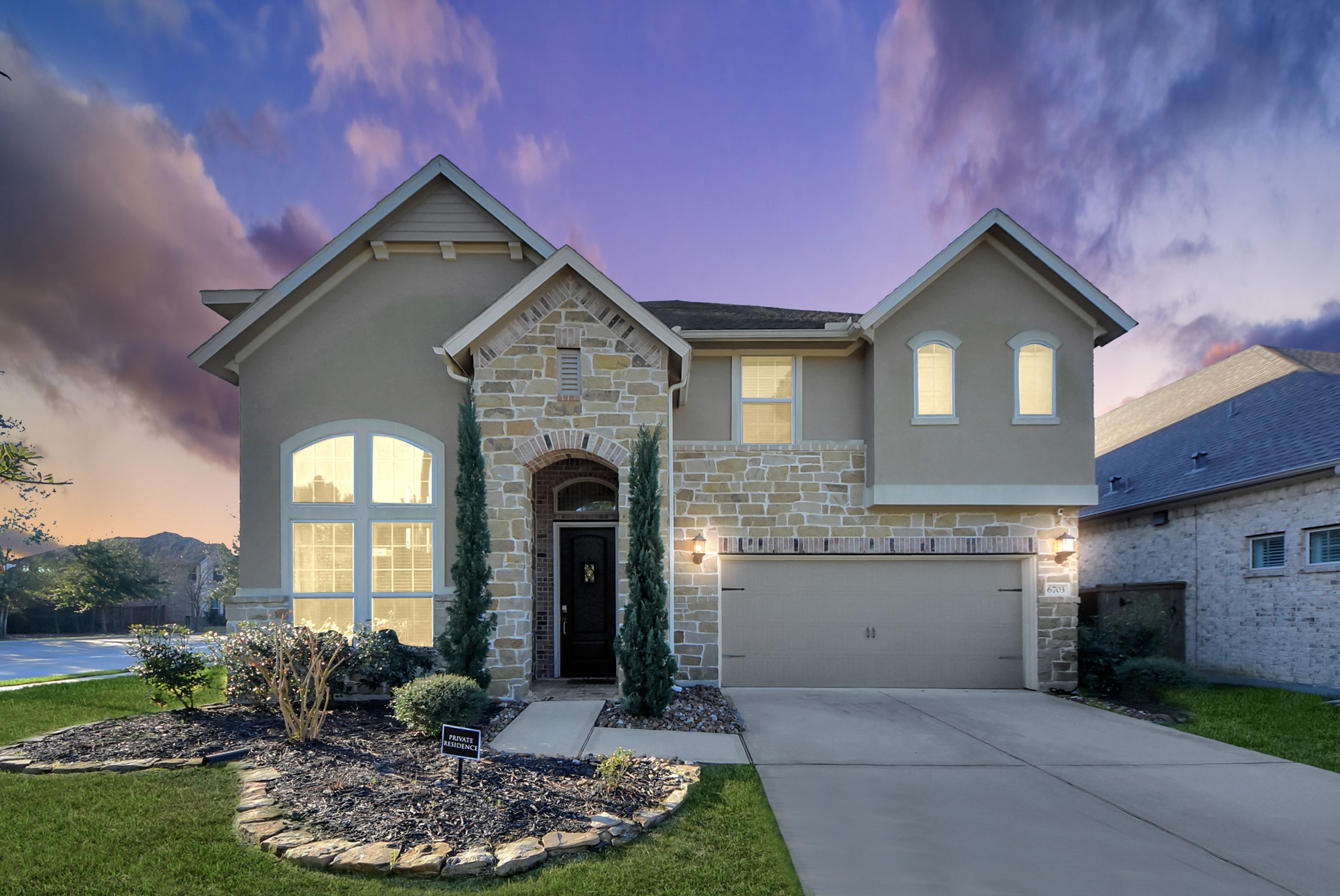 6703 Sandia Crest Street Spring, TX 77379 - Photo 1 of 45 a front view of a house with garden