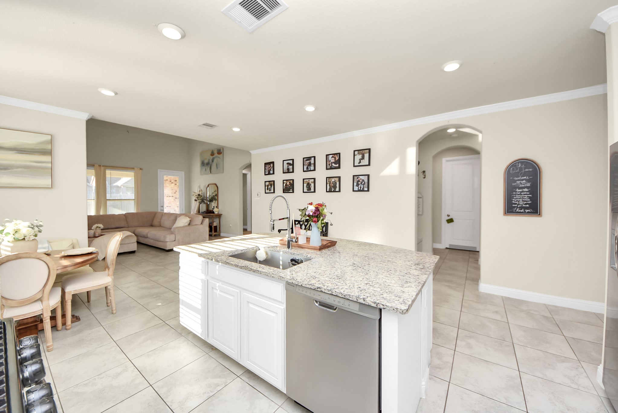 6703 Sandia Crest Street Spring, TX 77379 - Photo 12 of 45 a open kitchen with stainless steel appliances granite countertop a sink and a refrigerator