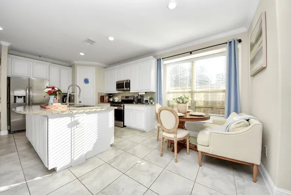 a dining room with furniture and window