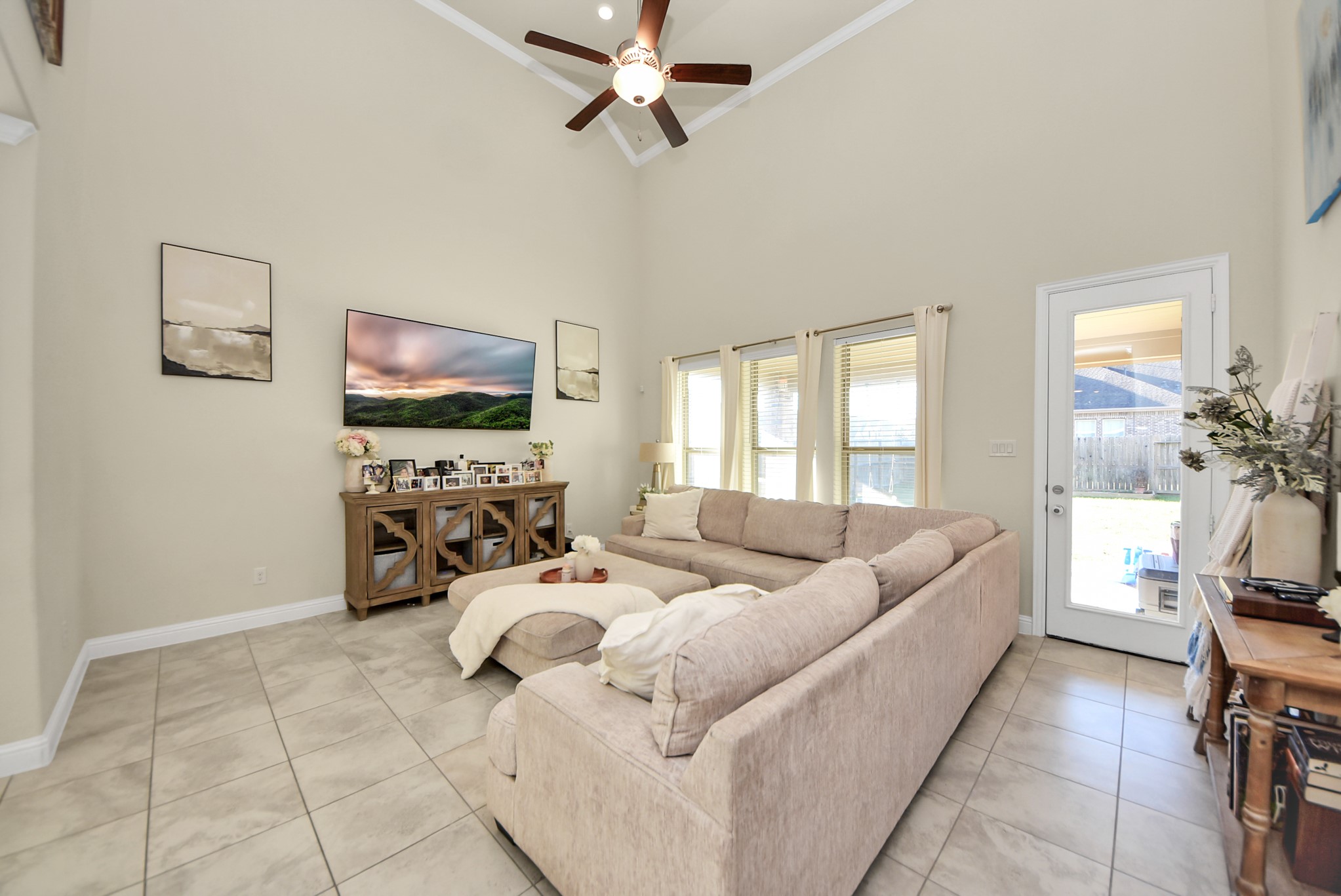 6703 Sandia Crest Street Spring, TX 77379 - Photo 15 of 45 a living room with furniture and a flat screen tv