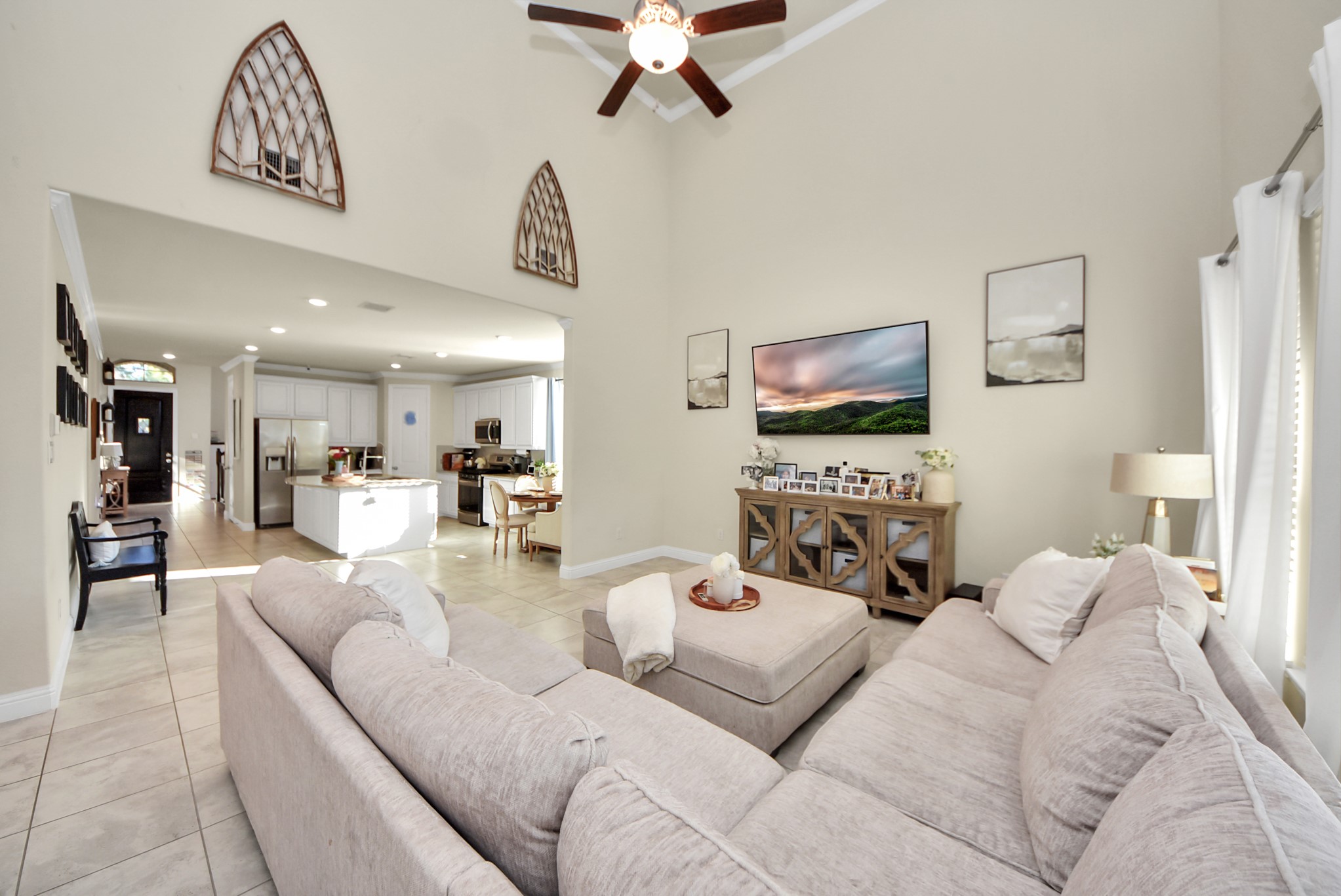 6703 Sandia Crest Street Spring, TX 77379 - Photo 16 of 45 a living room with furniture and a flat screen tv